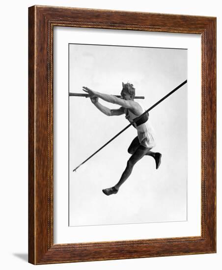 Athlete Doing a Dramatic Pole Vault in Preparation For the 1936 Olympics-null-Framed Photographic Print