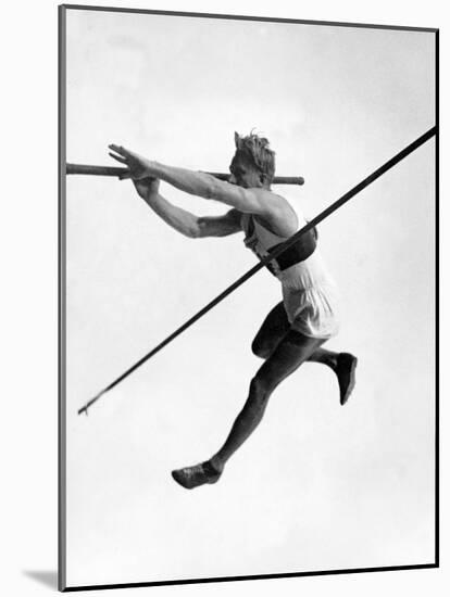 Athlete Doing a Dramatic Pole Vault in Preparation For the 1936 Olympics-null-Mounted Photographic Print