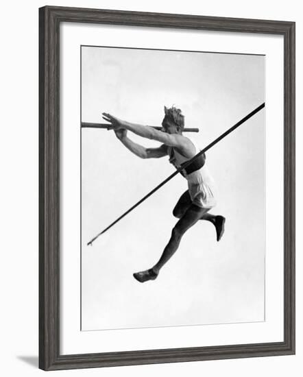 Athlete Doing a Dramatic Pole Vault in Preparation For the 1936 Olympics-null-Framed Photographic Print