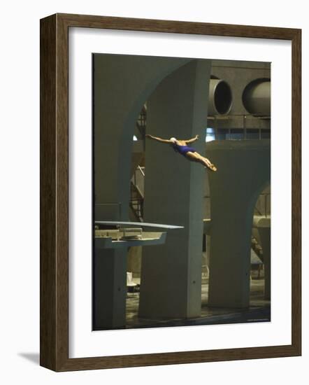 Athlete in Mid Air During a Platform Dive at Summer Olympics-Art Rickerby-Framed Photographic Print