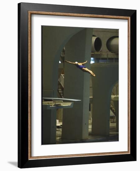 Athlete in Mid Air During a Platform Dive at Summer Olympics-Art Rickerby-Framed Photographic Print