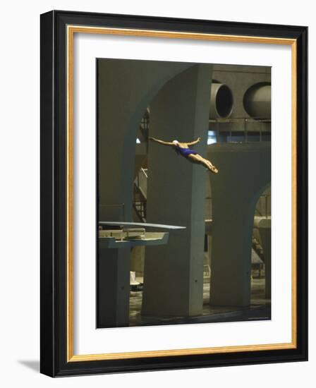 Athlete in Mid Air During a Platform Dive at Summer Olympics-Art Rickerby-Framed Photographic Print