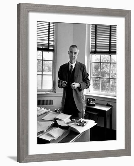 Atomic Scientist J. Robert Oppenheimer Standing in His Office after the Gray Report Was Published-Alfred Eisenstaedt-Framed Premium Photographic Print