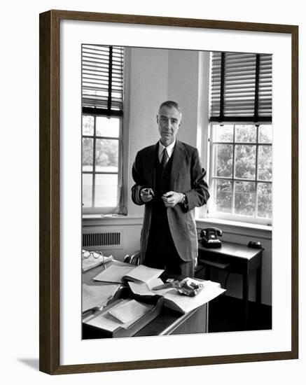 Atomic Scientist J. Robert Oppenheimer Standing in His Office after the Gray Report Was Published-Alfred Eisenstaedt-Framed Premium Photographic Print