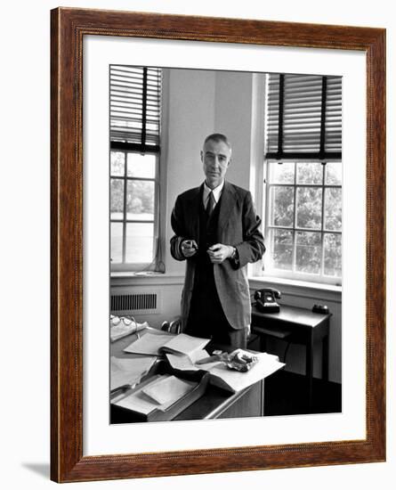 Atomic Scientist J. Robert Oppenheimer Standing in His Office after the Gray Report Was Published-Alfred Eisenstaedt-Framed Premium Photographic Print