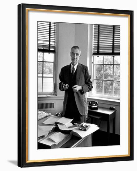 Atomic Scientist J. Robert Oppenheimer Standing in His Office after the Gray Report Was Published-Alfred Eisenstaedt-Framed Premium Photographic Print