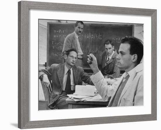 Atomic Scientists Discussing Subatomic Particles-Nat Farbman-Framed Premium Photographic Print