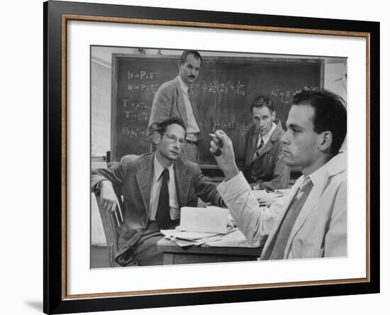 Atomic Scientists Discussing Subatomic Particles-Nat Farbman-Framed Premium Photographic Print