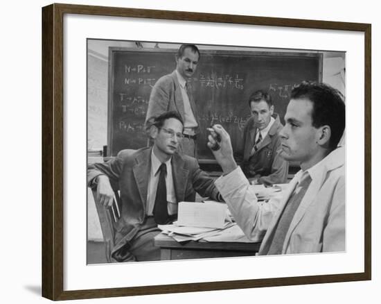 Atomic Scientists Discussing Subatomic Particles-Nat Farbman-Framed Premium Photographic Print