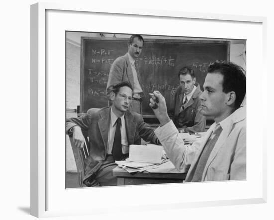 Atomic Scientists Discussing Subatomic Particles-Nat Farbman-Framed Premium Photographic Print