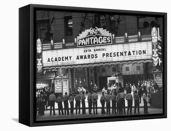 Attendants in Front of Pantages Theater Await Celebrities to Arrive for 26th Annual Academy Awards-George Silk-Framed Premier Image Canvas