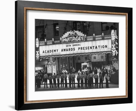 Attendants in Front of Pantages Theater Await Celebrities to Arrive for 26th Annual Academy Awards-George Silk-Framed Premium Photographic Print