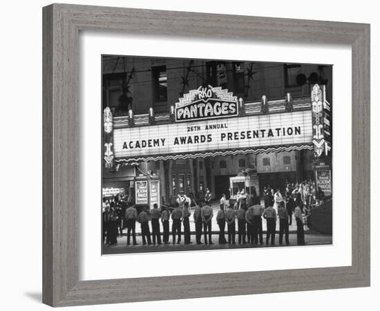 Attendants in Front of Pantages Theater Await Celebrities to Arrive for 26th Annual Academy Awards-George Silk-Framed Photographic Print