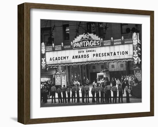 Attendants in Front of Pantages Theater Await Celebrities to Arrive for 26th Annual Academy Awards-George Silk-Framed Photographic Print