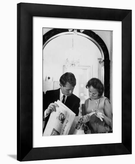 Attorney General Robert Kennedy and Wife Looking at Copy of the New York Times-George Silk-Framed Premium Photographic Print