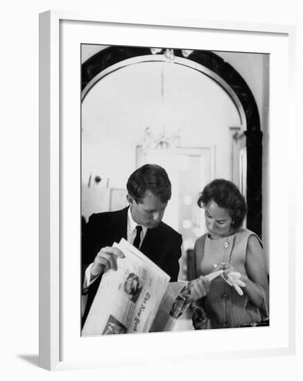 Attorney General Robert Kennedy and Wife Looking at Copy of the New York Times-George Silk-Framed Premium Photographic Print