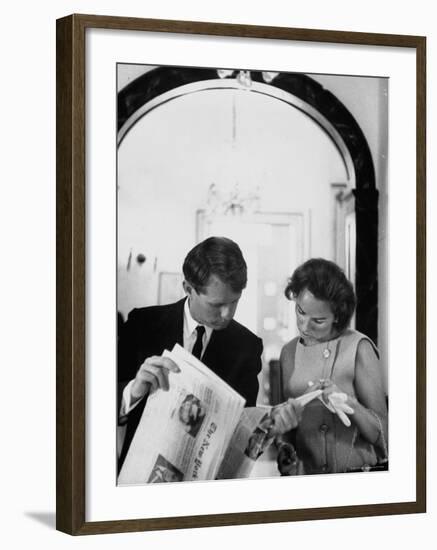 Attorney General Robert Kennedy and Wife Looking at Copy of the New York Times-George Silk-Framed Premium Photographic Print