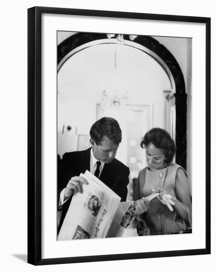 Attorney General Robert Kennedy and Wife Looking at Copy of the New York Times-George Silk-Framed Premium Photographic Print