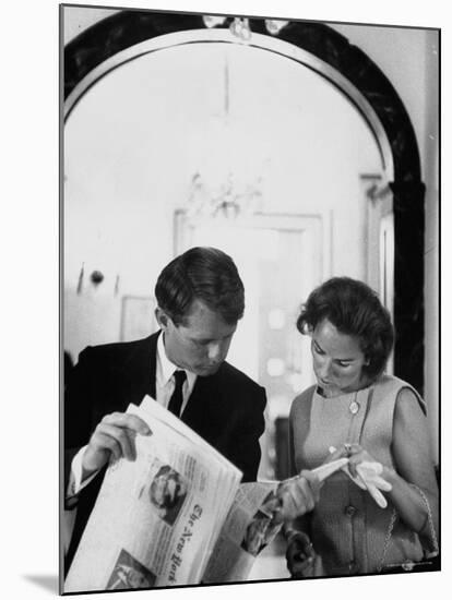 Attorney General Robert Kennedy and Wife Looking at Copy of the New York Times-George Silk-Mounted Premium Photographic Print