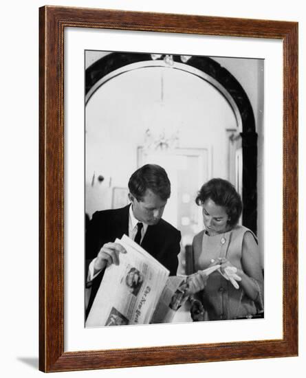 Attorney General Robert Kennedy and Wife Looking at Copy of the New York Times-George Silk-Framed Premium Photographic Print