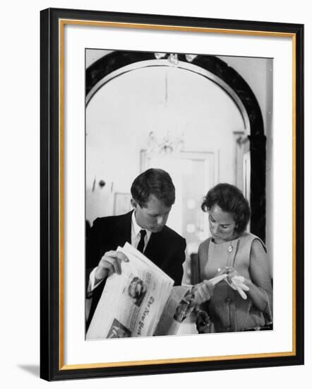 Attorney General Robert Kennedy and Wife Looking at Copy of the New York Times-George Silk-Framed Premium Photographic Print