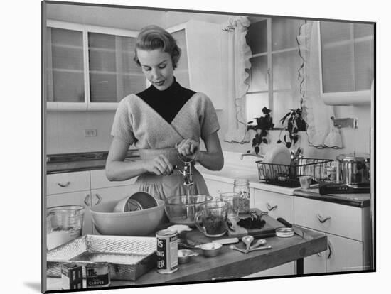 Attractive Housewife in Modern Kitchen, Preparing Food-Eliot Elisofon-Mounted Photographic Print