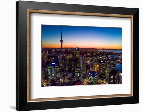 Auckland, New Zealand. The Auckland Skytower and harbor at night.-Micah Wright-Framed Photographic Print