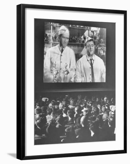 Audience at Omaha Theater Watching Abbott and Costello in Feature Picture "Who Done It"-Alfred Eisenstaedt-Framed Premium Photographic Print
