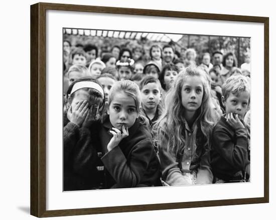 Audience of Children Sitting Very Still, with Rapt Expressions, Watching Puppet Show at Tuileries-Alfred Eisenstaedt-Framed Photographic Print