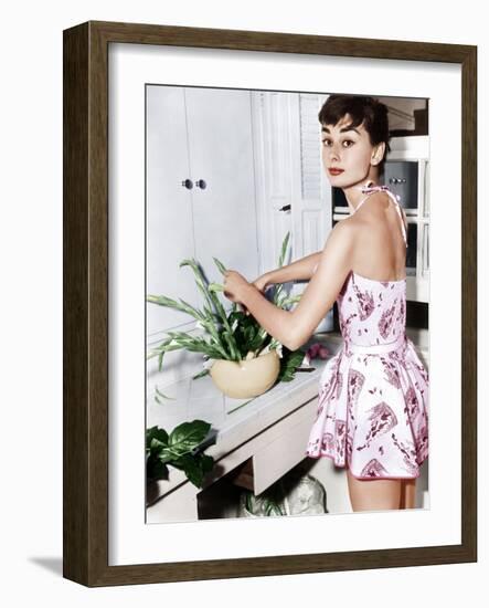 Audrey Hepburn Creates a Flower Arrangement, Ca. Early 1950s--Framed Photo