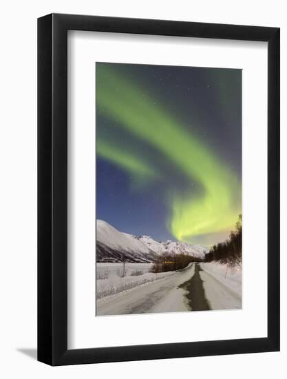Aurora Borealis over a Snow-Covered Street in Wintry Mountain Landscape, Tromsš, Norway-P. Kaczynski-Framed Photographic Print