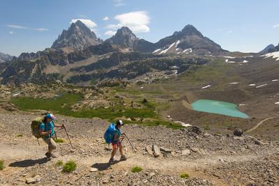 Female Backpackers Hiking Down From Hurricane Pass On Teton Crest