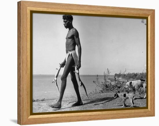 Australian Aborigine Man Bringing Back Two Monitor Lizards Known as Goannas to His Clan-Fritz Goro-Framed Premier Image Canvas