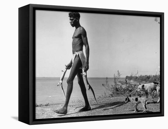 Australian Aborigine Man Bringing Back Two Monitor Lizards Known as Goannas to His Clan-Fritz Goro-Framed Premier Image Canvas