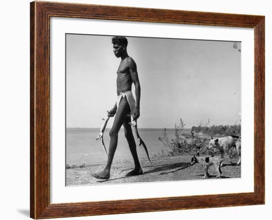 Australian Aborigine Man Bringing Back Two Monitor Lizards Known as Goannas to His Clan-Fritz Goro-Framed Photographic Print