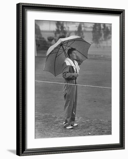 Australian Golfer Peter Thompson, Standing under Oversized Umbrella During the Los Angeles Open-Allan Grant-Framed Premium Photographic Print