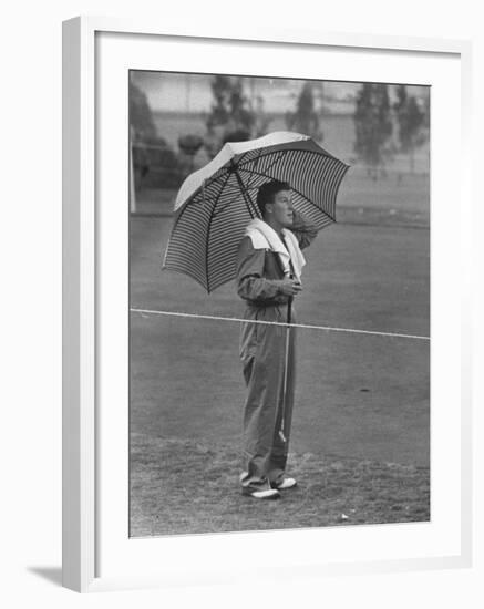 Australian Golfer Peter Thompson, Standing under Oversized Umbrella During the Los Angeles Open-Allan Grant-Framed Premium Photographic Print