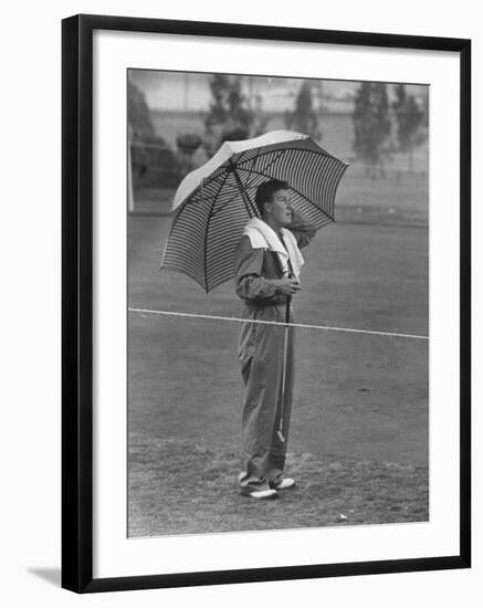 Australian Golfer Peter Thompson, Standing under Oversized Umbrella During the Los Angeles Open-Allan Grant-Framed Premium Photographic Print