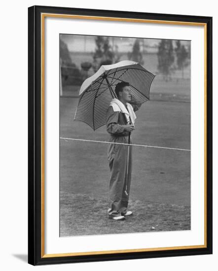 Australian Golfer Peter Thompson, Standing under Oversized Umbrella During the Los Angeles Open-Allan Grant-Framed Premium Photographic Print