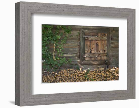 Austria, Tyrol, firewood in front of a wooden facade.-Roland T. Frank-Framed Photographic Print