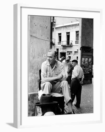 Author Graham Greene Sitting on the Set of "Our Man in Havana."-Peter Stackpole-Framed Premium Photographic Print