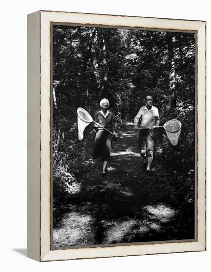 Author Vladimir Nabokov and His Wife Vera Chasing Butterflies-Carl Mydans-Framed Premier Image Canvas