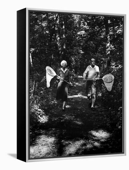 Author Vladimir Nabokov and His Wife Vera Chasing Butterflies-Carl Mydans-Framed Premier Image Canvas