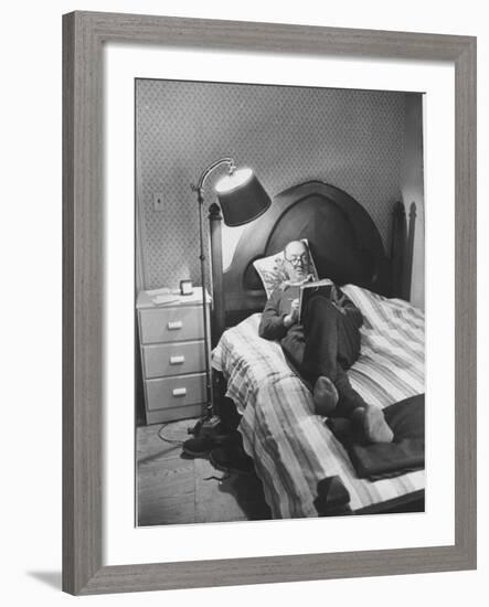 Author Vladimir Nabokov Writing While Lying on His Bed at Home-Carl Mydans-Framed Premium Photographic Print