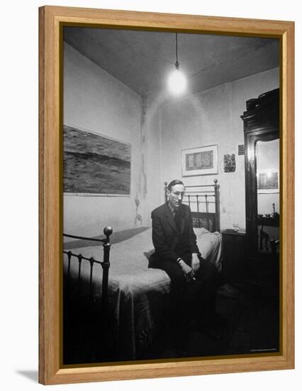 Author William Burroughs, an Ex Dope Addict, Relaxing on a Shabby Bed in a "Beat Hotel"-Loomis Dean-Framed Premier Image Canvas