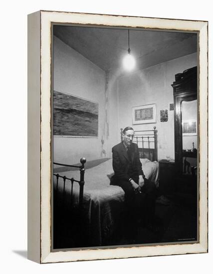 Author William Burroughs, an Ex Dope Addict, Relaxing on a Shabby Bed in a "Beat Hotel"-Loomis Dean-Framed Premier Image Canvas