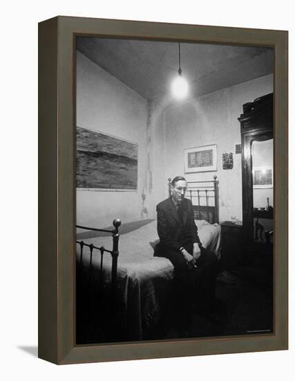 Author William Burroughs, an Ex Dope Addict, Relaxing on a Shabby Bed in a "Beat Hotel"-Loomis Dean-Framed Premier Image Canvas