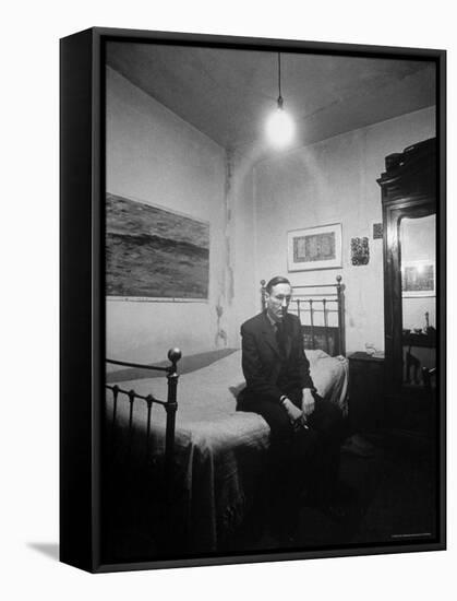 Author William Burroughs, an Ex Dope Addict, Relaxing on a Shabby Bed in a "Beat Hotel"-Loomis Dean-Framed Premier Image Canvas