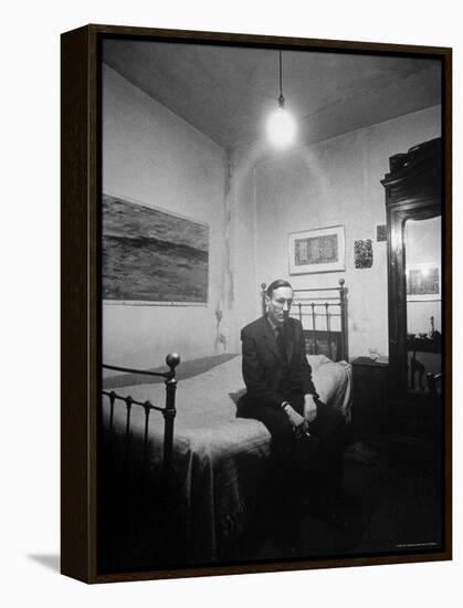Author William Burroughs, an Ex Dope Addict, Relaxing on a Shabby Bed in a "Beat Hotel"-Loomis Dean-Framed Premier Image Canvas