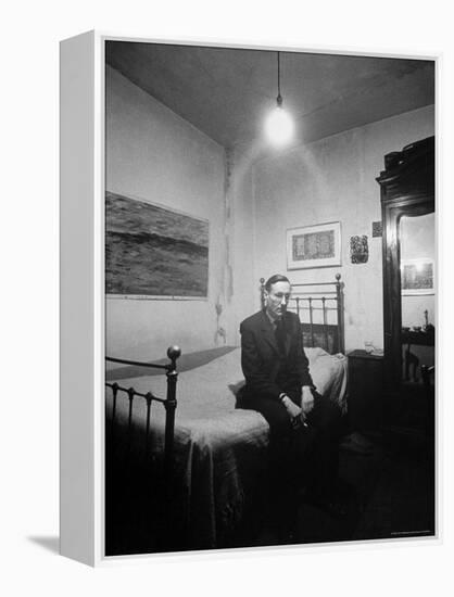 Author William Burroughs, an Ex Dope Addict, Relaxing on a Shabby Bed in a "Beat Hotel"-Loomis Dean-Framed Premier Image Canvas